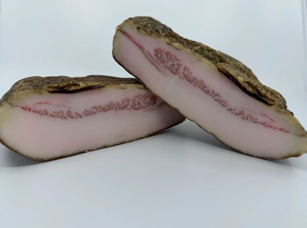 Two pieces of cured guanciale